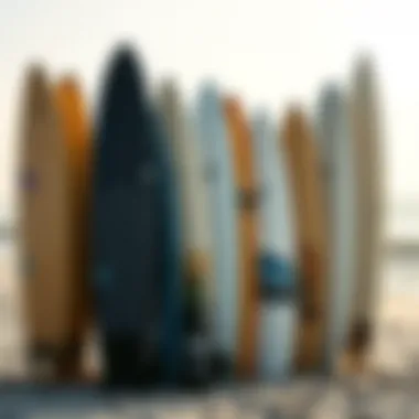 Diverse Surfboard Collection A variety of surfboards displayed on a beach setting