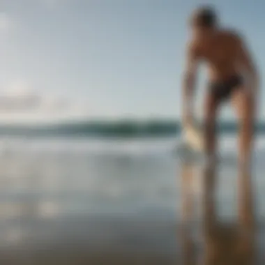 Surfer examining surfboard dimensions