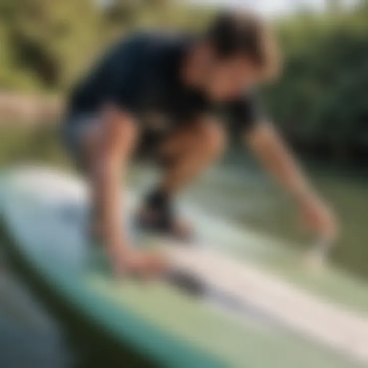 Demonstration of applying epoxy to a wakesurf board