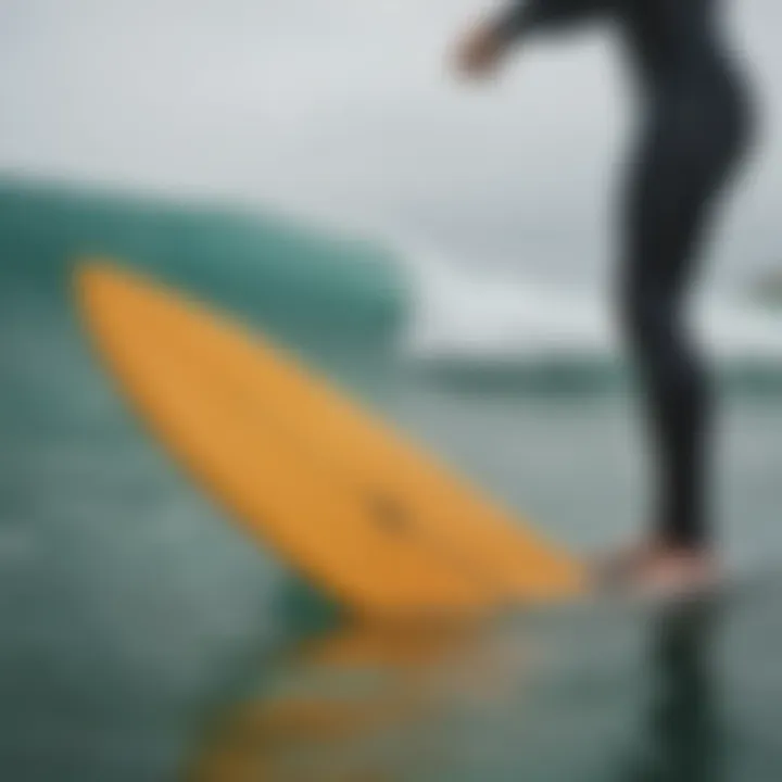 A surfer demonstrating the use of Churchill swimfins in action