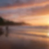 A breathtaking sunset over the ocean with surfers in the foreground