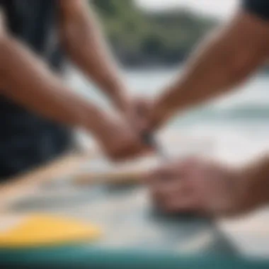 A surfer carefully assembling a four-piece travel surf rod