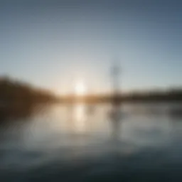 Paddle board with sail on a tranquil lake