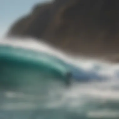 Dynamic coastline with surfers enjoying the waves