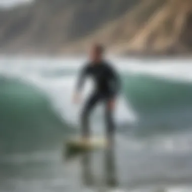 An instructor demonstrating proper surfing techniques on the beach