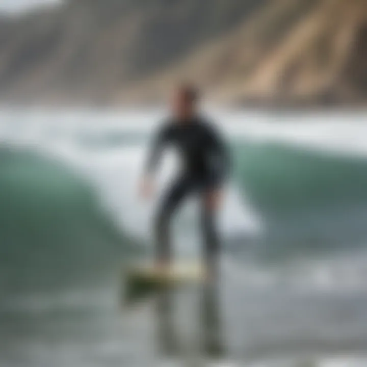 An instructor demonstrating proper surfing techniques on the beach