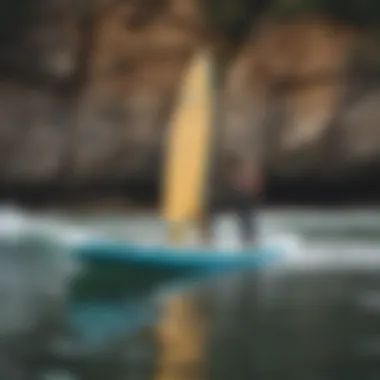 An inflatable paddleboard displayed beside essential surfing gear