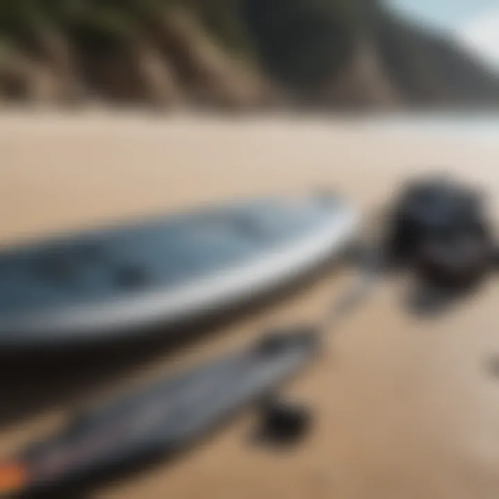 Surfboard and wet suit laid out on a sandy beach ready for action