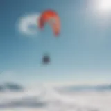 A dynamic snow kite surfer gliding across a snowy landscape under a clear blue sky