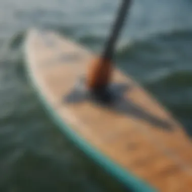 A close-up of a used racing paddle board showcasing its design and features.