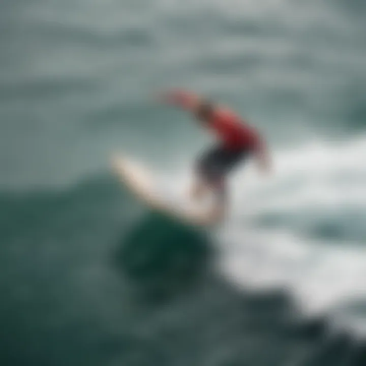 An aerial shot of a surfer riding a hydro foil surf board above the water