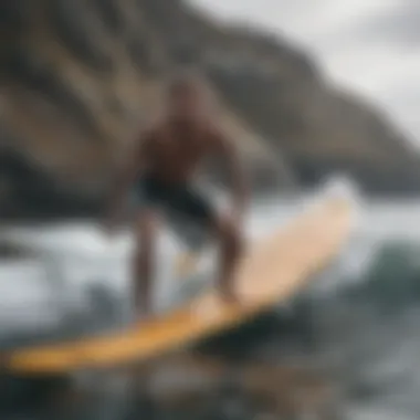 Adventurous surfer at a rocky coastline