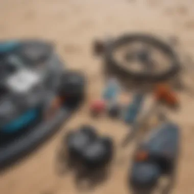 Close-up of essential kitesurfing gear laid out on the sandy beach