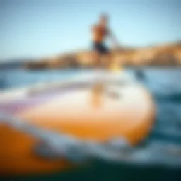 A close-up view of a modern propelled paddle board showcasing its sleek design