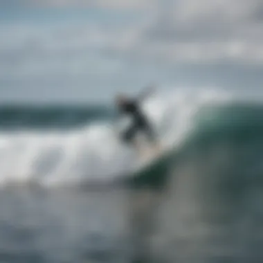 A surfer riding a wave with a focus on the performance of a single fin setup.