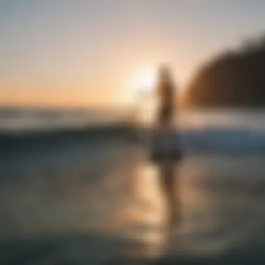 Scenic view of a paddle boarder enjoying a sunset on the water