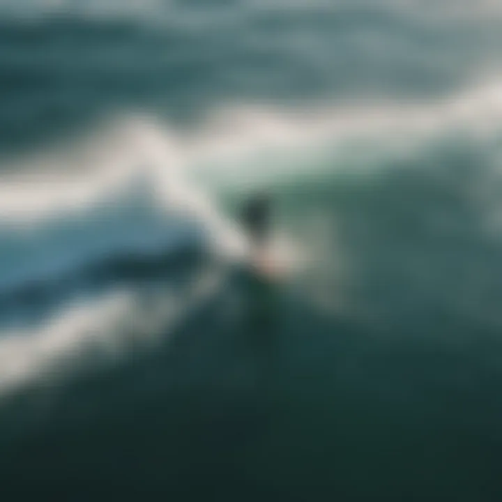 Aerial view of a surfer using a foil surf machine on a stunning wave.