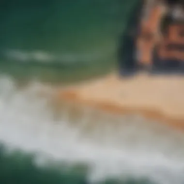 An aerial view of the picturesque coastline of Hossegor with surfers dotting the waves.