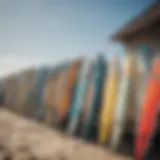 Vibrant surfboards lined up on the beach showcasing local art