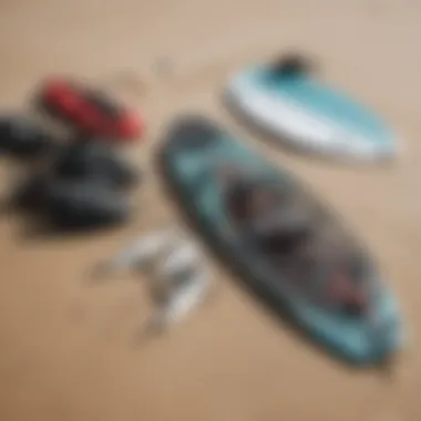 Close-up of essential kite surfing gear laid out on the sand