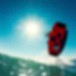 A vibrant kiteboard soaring across the waves under a clear blue sky