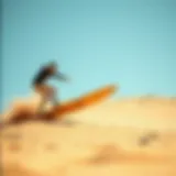 A land surfboarder showcasing advanced techniques on a sandy slope