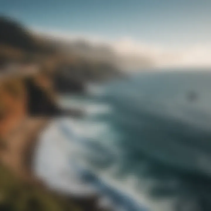 Scenic view of the coastline with surfers