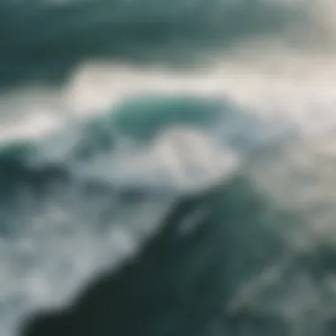 Aerial view of surfers riding the waves under varying wind conditions