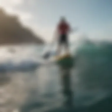 A paddle boarder navigating through choppy ocean waters.