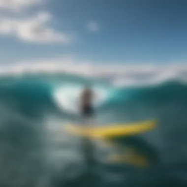 A vibrant SUP gliding over ocean waves under a clear sky.