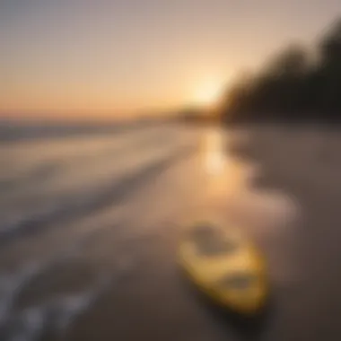 A serene sunset vista with a SUP resting on the shore.