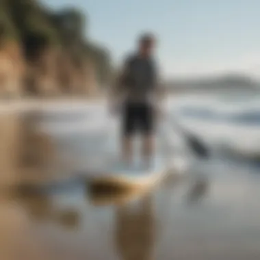 Paddle boarder using a locking device on the beach