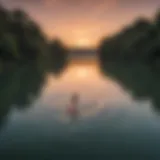 Serene view of Lady Bird Lake at sunset with paddleboarders gliding across the water