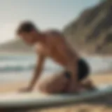 A surfer stretching on the beach to prevent muscle cramps