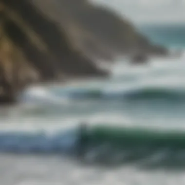 A breathtaking view of Cornwall's coastline with surfers catching waves