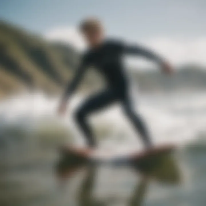 A surfer wearing wetsuit booties in action