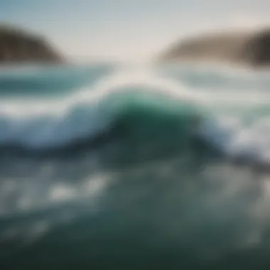 An aerial view of surfers riding waves along a picturesque coastline