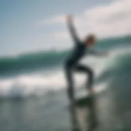 A surfer demonstrating dynamic stretching before hitting the waves