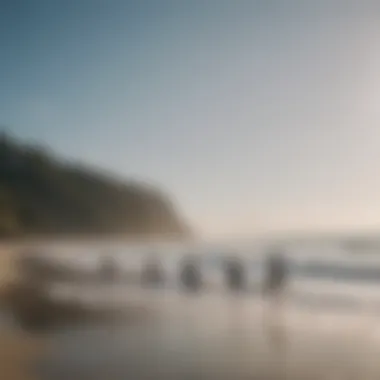 A group of individuals practicing yoga on the shore, with waves crashing in the background.