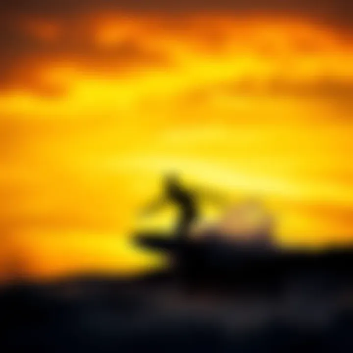 Surfer silhouetted against a vibrant sunset sky while catching a wave