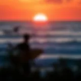 Stunning sunset view over the ocean with surfers riding waves