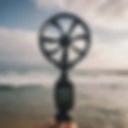 A close-up of a handheld anemometer used by surfers to measure wind speed.