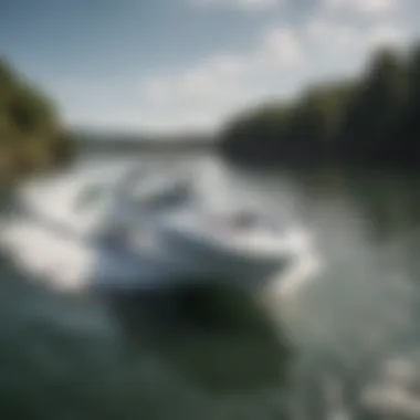 A sleek, entry-level wakesurf boat gliding across calm waters