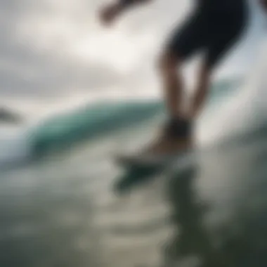 Surfer riding a wave wearing Vans surf booties